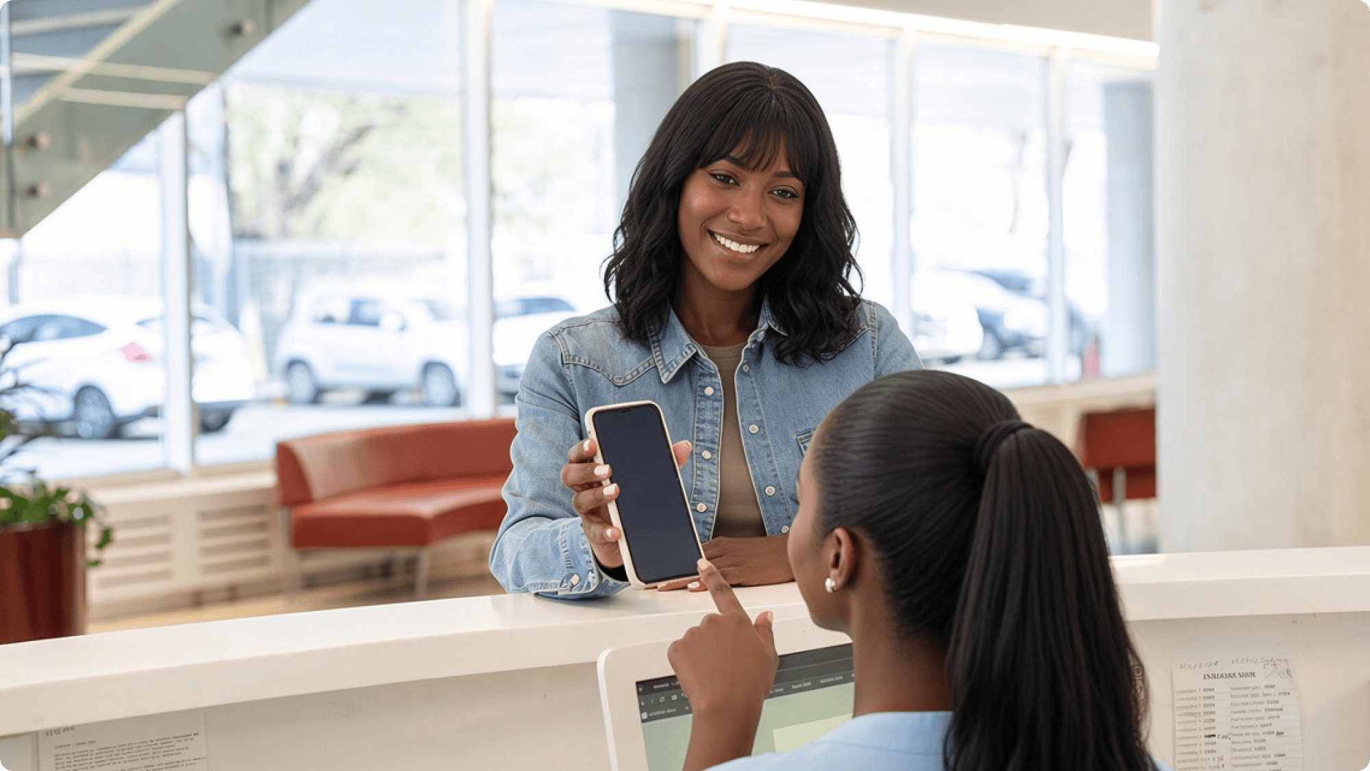 Patient checking in at a clinic reception desk